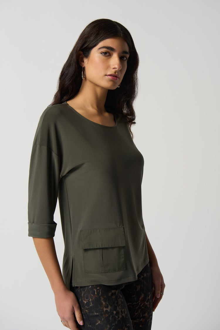 This lovely Joseph Ribkoff Dolman Sleeve Boxy Top is made in a smooth woven fabric creates this silky knit top. Intentional design features include boxy silhouette, three-quarter dolman sleeves and folded cuffs. A practical side pocket rounds out the look that is perfect to wear dressed up or casual with jeans.