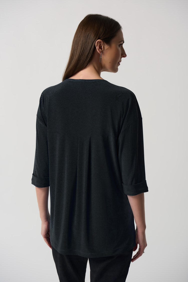 This lovely Joseph Ribkoff Dolman Sleeve Boxy Top is made in a smooth woven fabric creates this silky knit top. Intentional design features include boxy silhouette, three-quarter dolman sleeves and folded cuffs. A practical side pocket rounds out the look that is perfect to wear dressed up or casual with jeans.