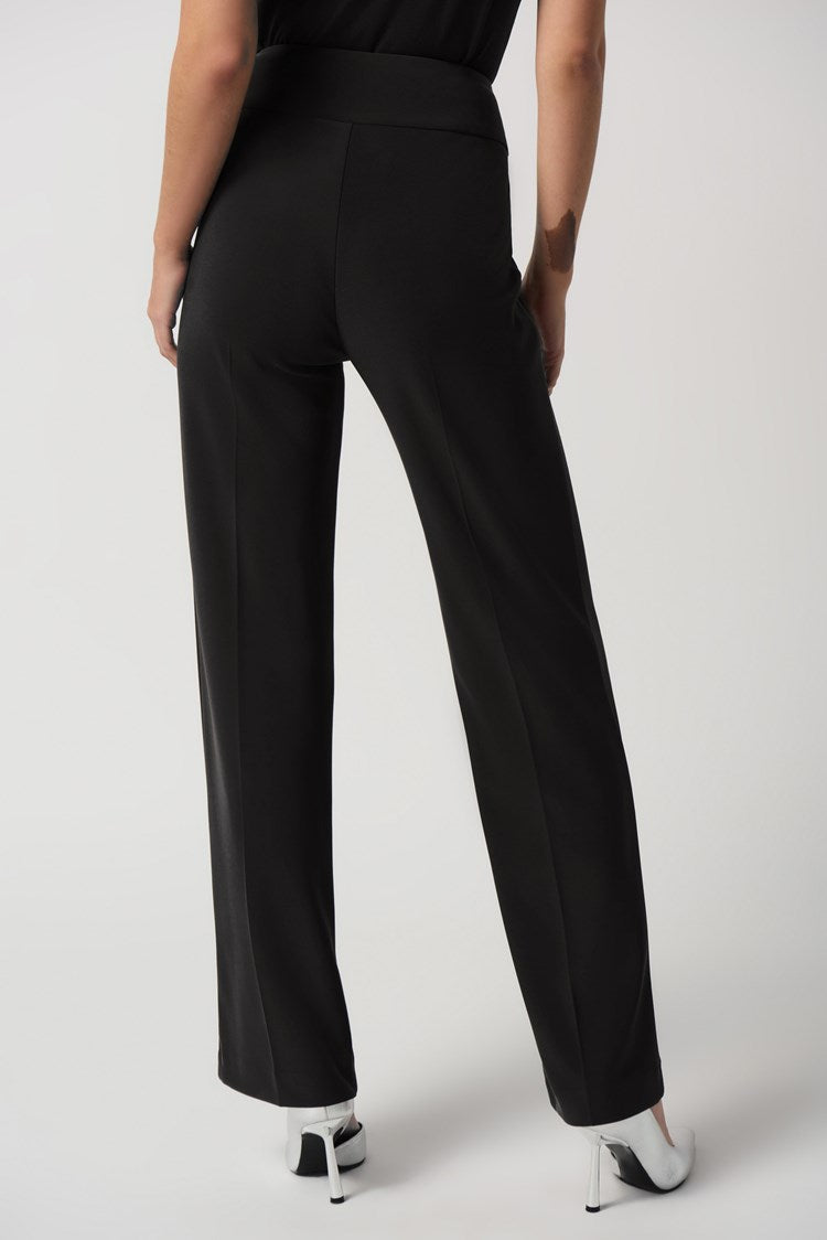 Add the Joseph Ribkoff Wide-Leg Pull-On Pants to your wardrobe, and you'll have a go-to style for any occasion. This bonded silky knit material is highly sought after and perfect for creating various looks. The wide-leg silhouette is flattering on any figure, while the contoured waistband provides a comfortable, tailored fit. 