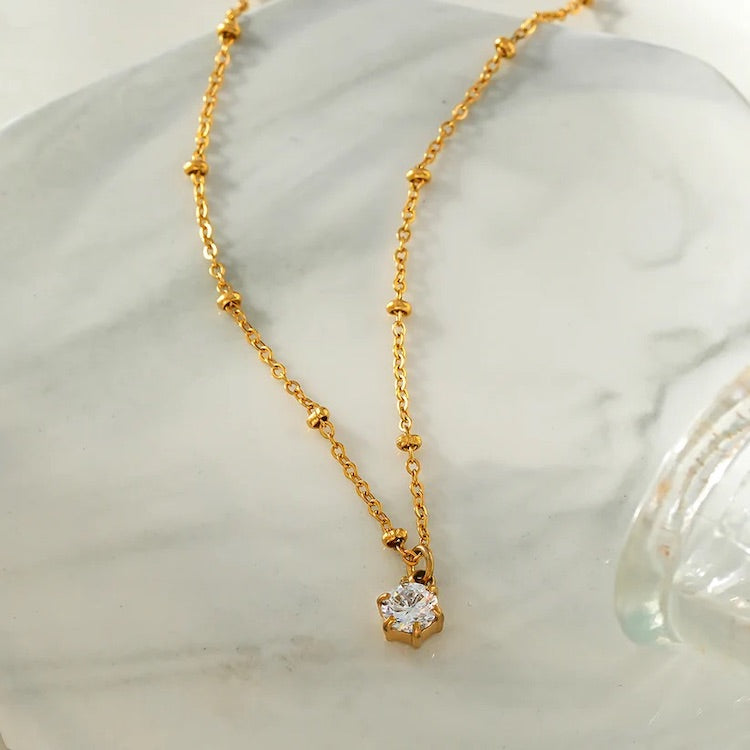 KADIRI: Solitaire Zirconia Charm Pendant on a Beaded Chain Necklace