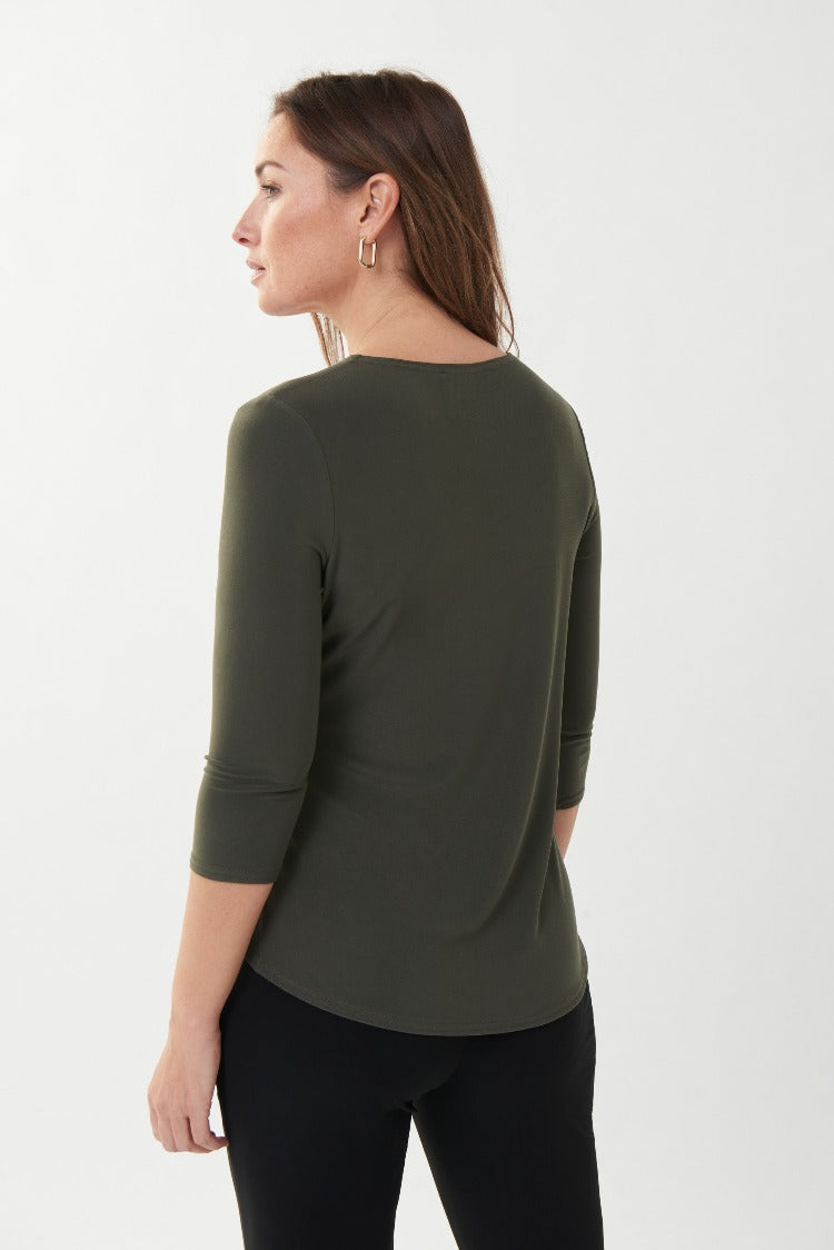 This Joseph Ribkoff Long Sleeve Top is the perfect basic for layering or wearing on its own. It features a round neckline, 3/4 length sleeves and a stylish side slit. Proudly made in Canada.