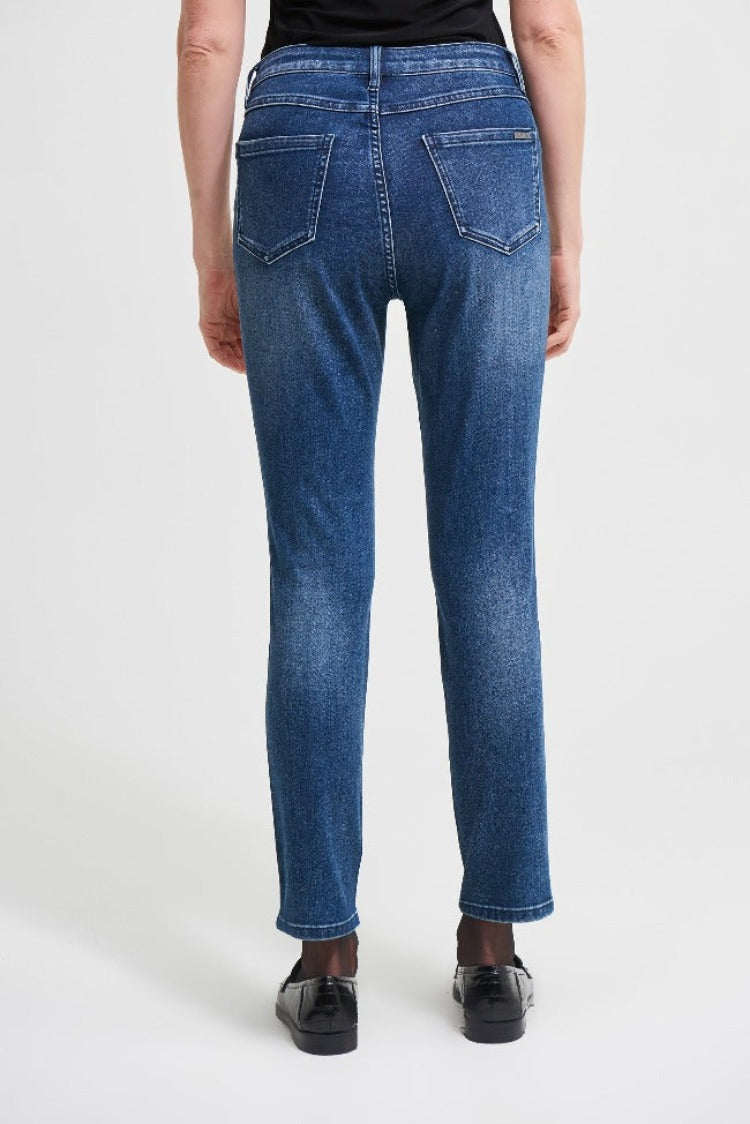 Bring that posh city style home with these Joseph Ribkoff Denim Pants! These slim-fit, straight leg jeans feature an art-insipired rhinestone facial design on the leg, making these a truly unique pair of jeans. For maximum impact, pair these with a bold top or jacket. 