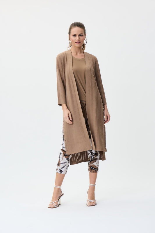 Comfortable and flattering this Joseph Ribkoff Long Cardigan will become a go to for you. The open front is perfect to show off your style and the side slits have studs along the edge for an edgy look that you can toss on over a casual or dressy style.