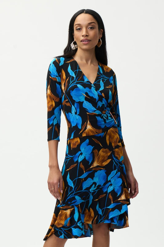 Designed in a flattering wrap style, this Joseph Ribkoff Blue Floral Print Dress, is a beautiful statement of colour. From its 3/4 sleeves and gathered waist to its ruffled hemline you will feel fabulous every time you wear it.