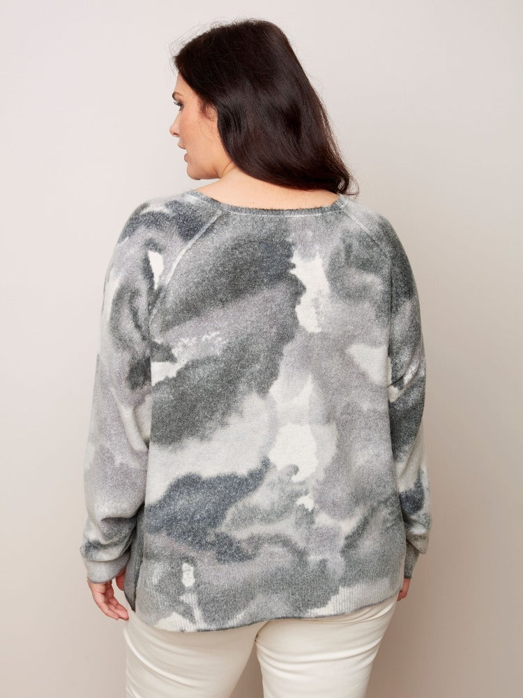 Get into your fashion groove with this tie-dye inspired Charlie B Plus Reversible Printed Crew Neck Sweater. This sweater is so versatile with a relaxed fit, roomy raglan sleeves and a classic crew neckline. The reversible option allows you to wear it inside and out!