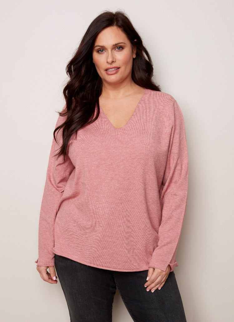 Your look will be anything but basic with this Charlie B Plus Basic V-Neck Sweater! From your best skinny jeans to business slacks you can wear it with just about anything.  Thanks to its soft, plushy yarn, the flattering V neck and versatility, it is sure to become one of your favourites.  